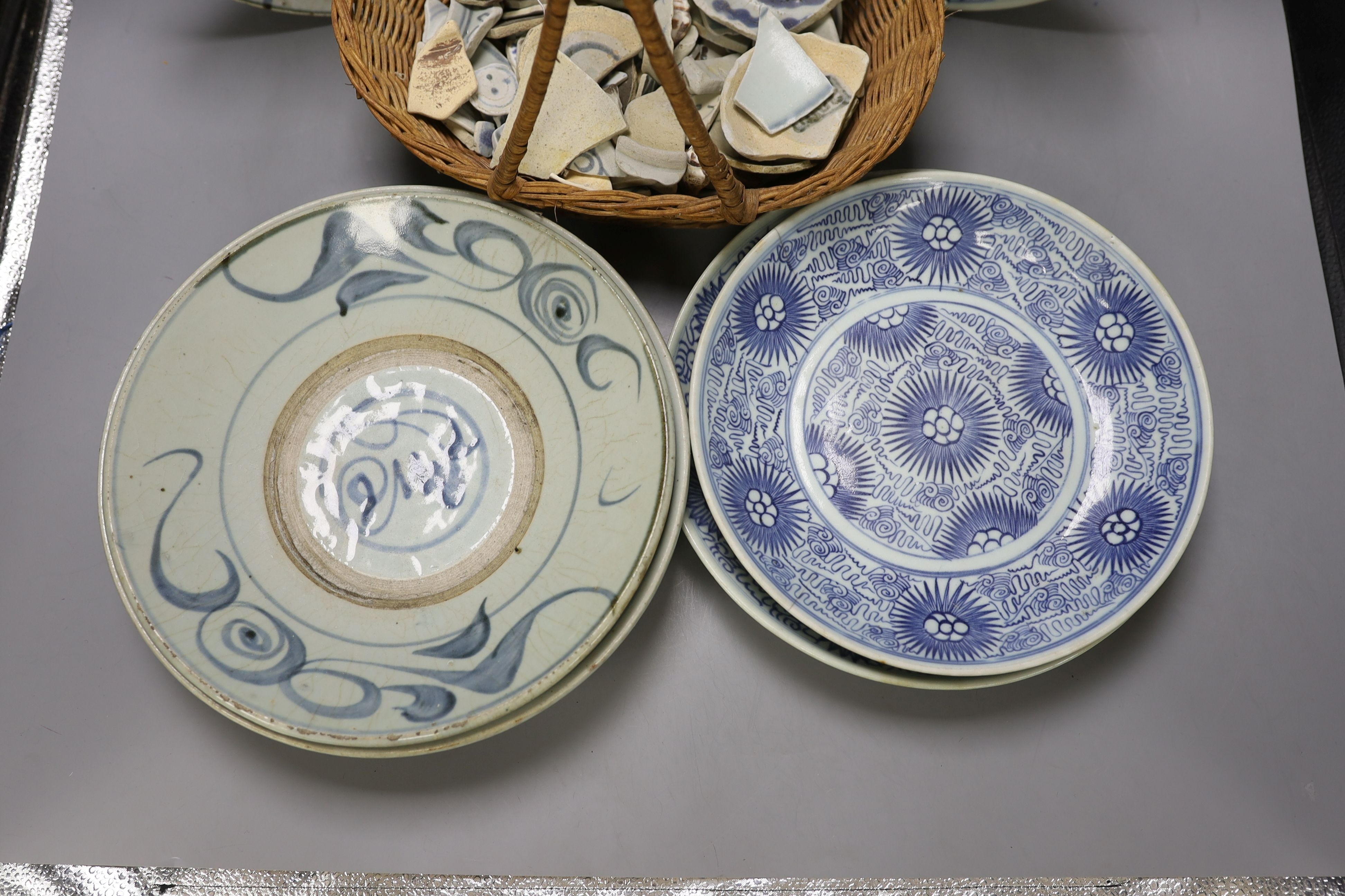 Six 19th century blue and white Chinese dishes, together with a basket of assorted fragments